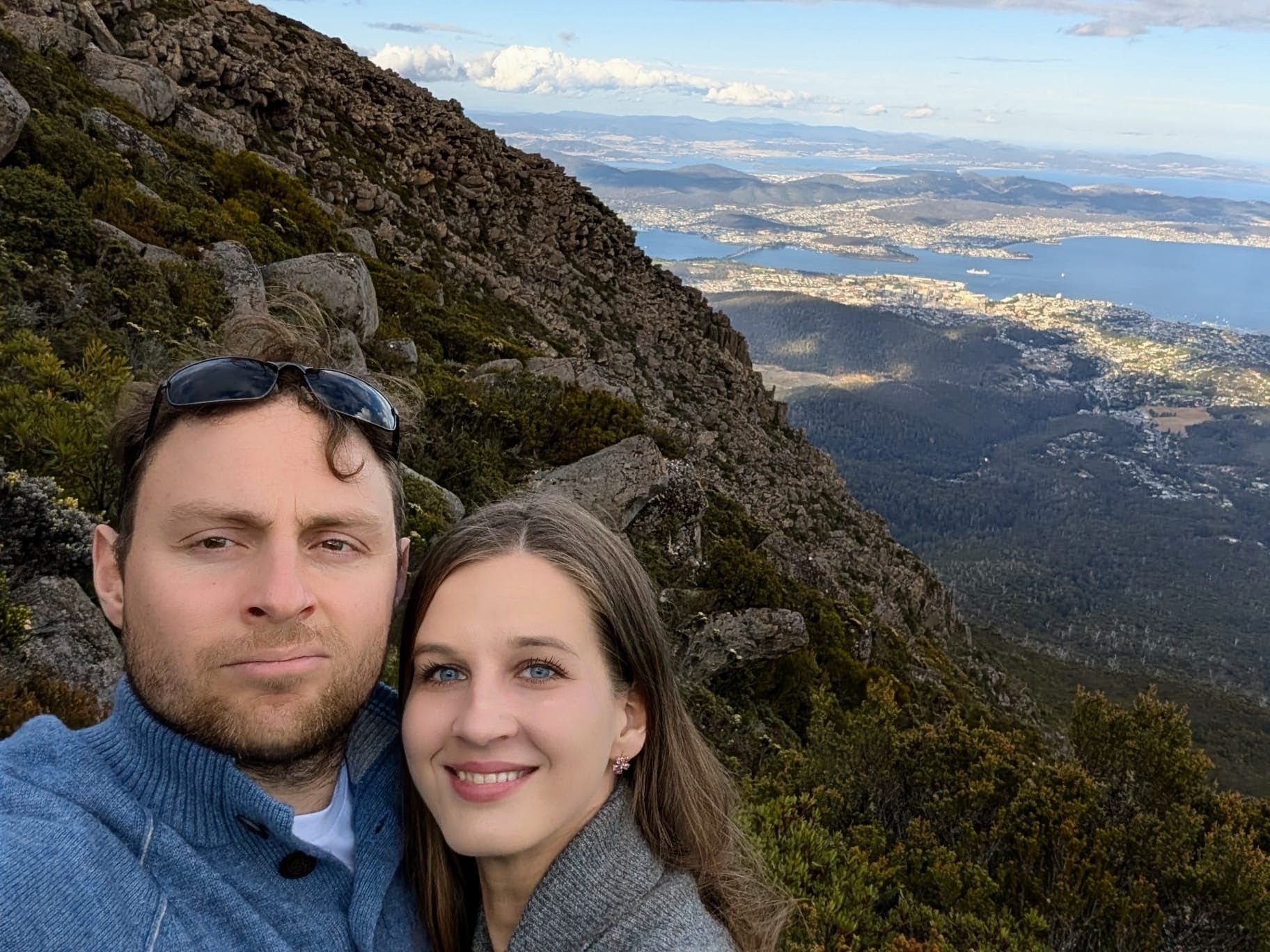 Elena and Louis on a mountain lookout above the harbour